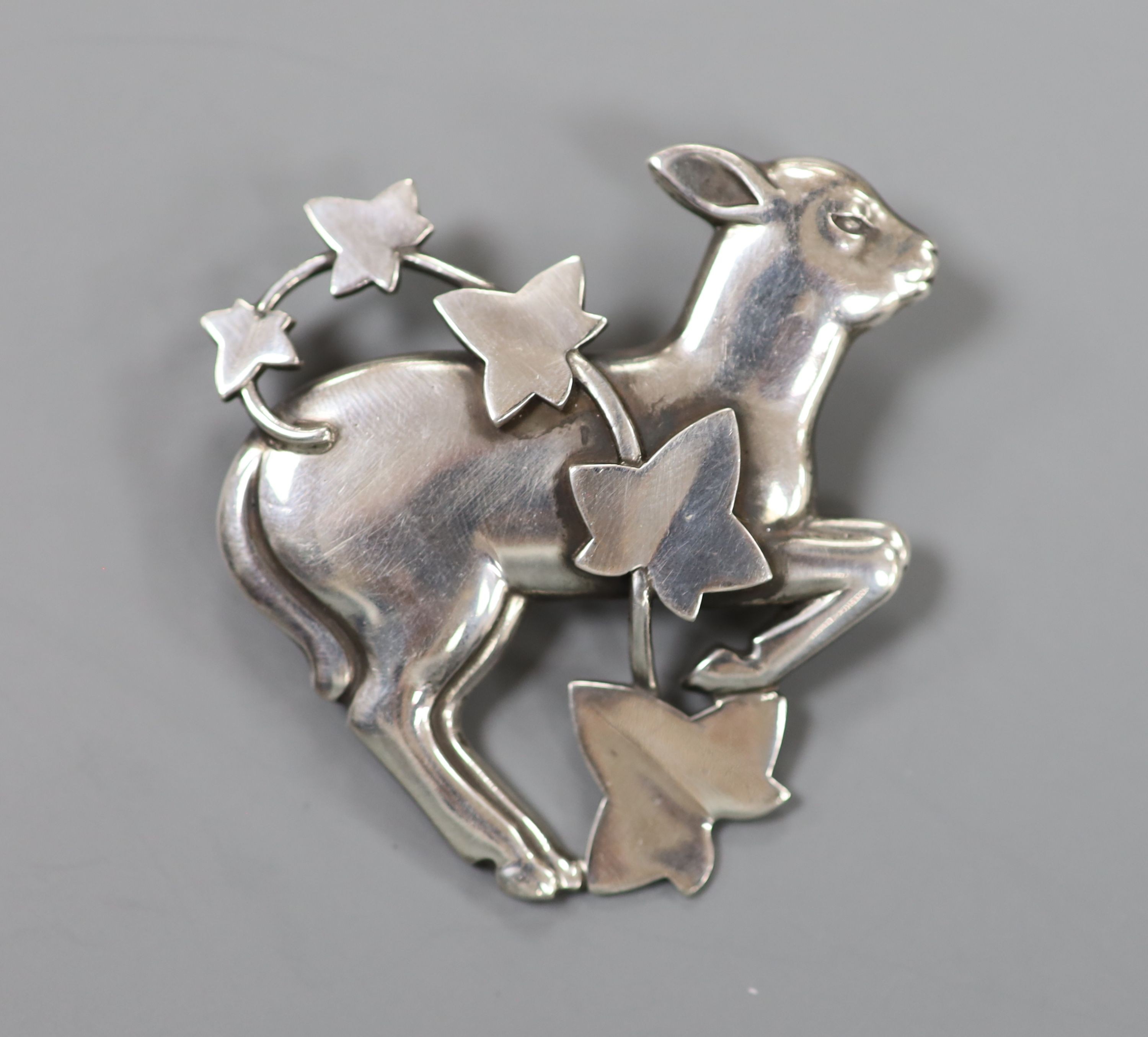 A Georg Jensen sterling lamb and frond brooch, no. 311, 47mm.